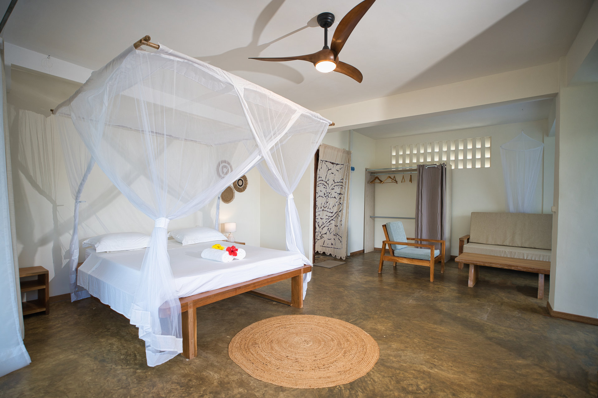 Family Studio — canopy bed with pull-out sofa and wardrobe area visible